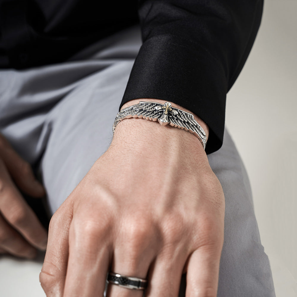 Calvi - Pulsera rígida de plata con alas de ángel y cruz
